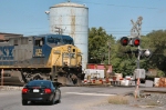Car driver prudently waits for CSX 232 to clear the crossing
